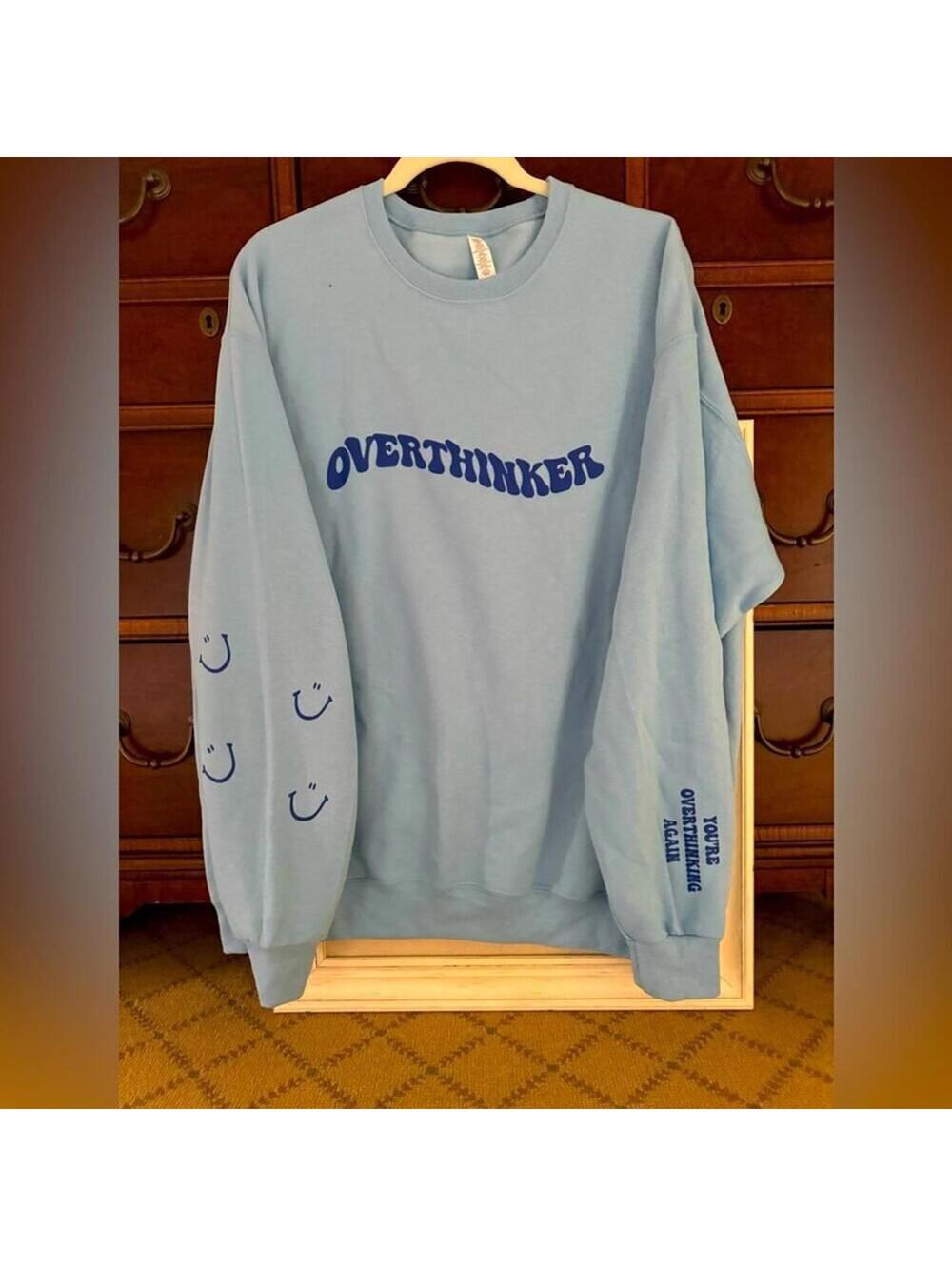Light blue crewneck sweatshirt long sleeved  "Overthinker" in navy text
